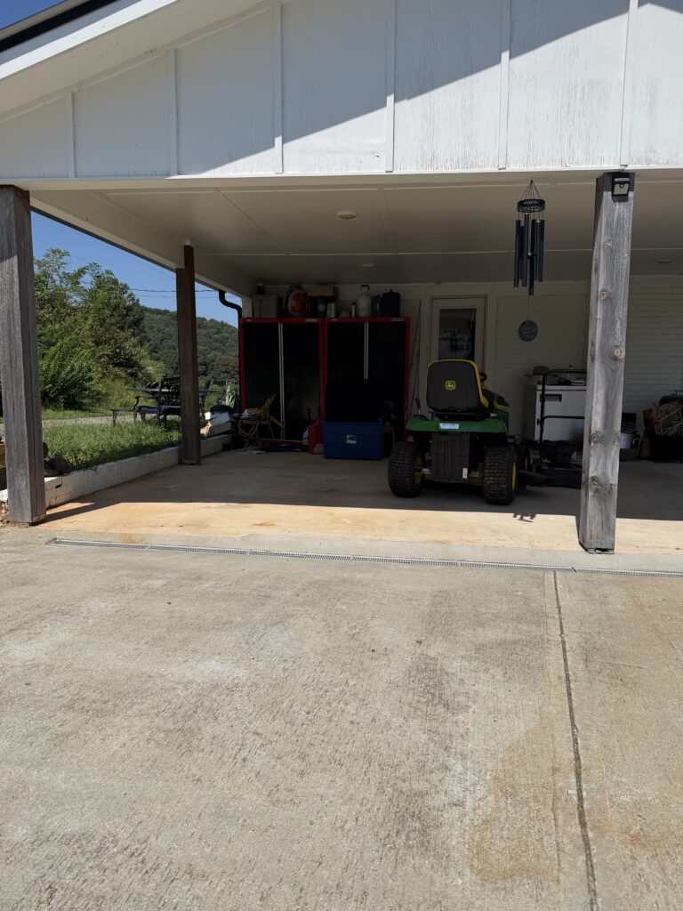 Carport after junk removal in Blairsville, GA, showing the cleared space following removal of unwanted household items