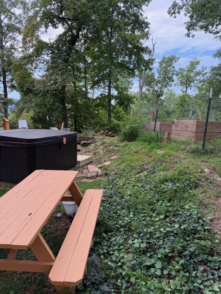 AFTER — The area beside a hot tub is cleared of dismantled deck stairs, oversized beams, and construction debris following removal by Appalachian Junk Removal, LLC in Clayton, Georgia.