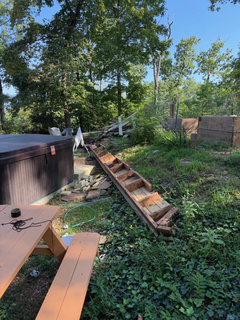 BEFORE — Heavy wooden deck stairs, long beams, and dismantled decking awaiting removal by Appalachian Junk Removal, LLC in Clayton, Georgia.